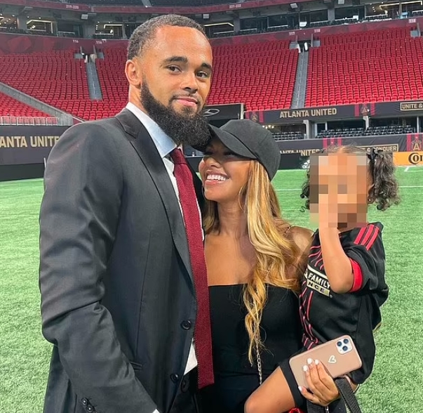 Anton Walkes with his girlfriend and their baby