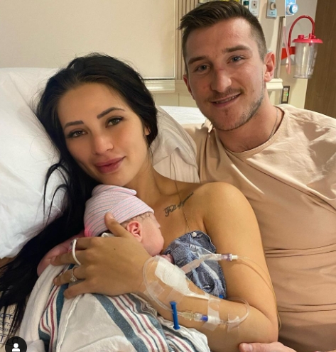 Tanner Jeannot with his wife, Keely and their baby boy