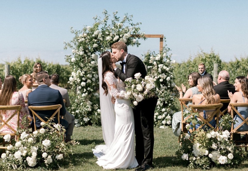 Chris Tierney kissing his wife, Olivia