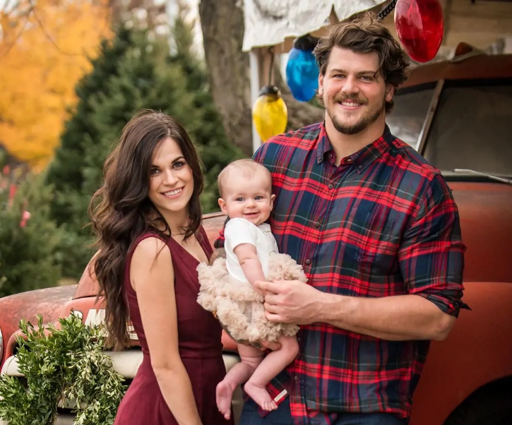 Taylor Lewan with his wife, Taylin and their daughter, Wynne