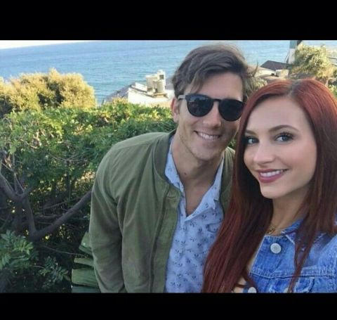 Brent Antonello in green jacket, blue shirt with red-haired girlfriend Taylor Ackerman
