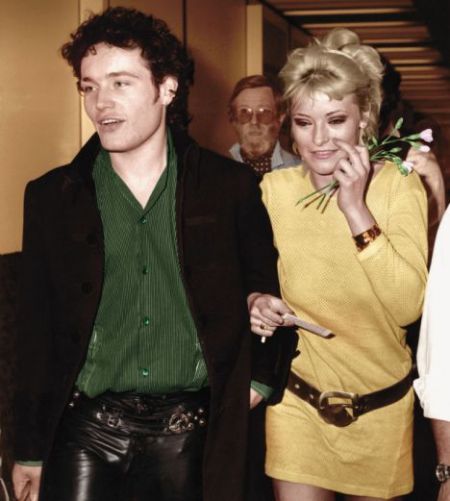 Amanda Donohoe and Adam Ant appear at a party together.
