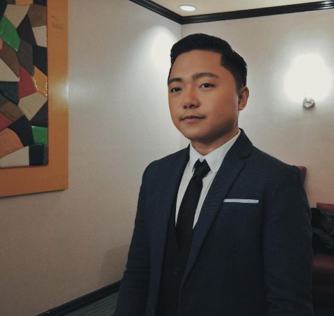 Jake Zyrus in a black suit.
