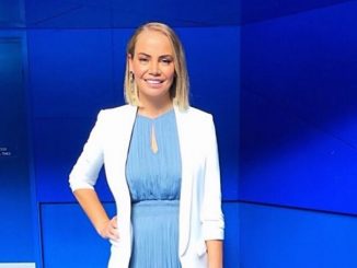 Jelena Dokic, who has an estimated total net worth of $5 million, in a blue dress and white sweater.