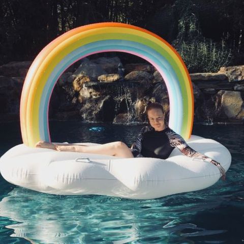 Liv Hewson spending her time on swimming pool while laying on the swimming ring.