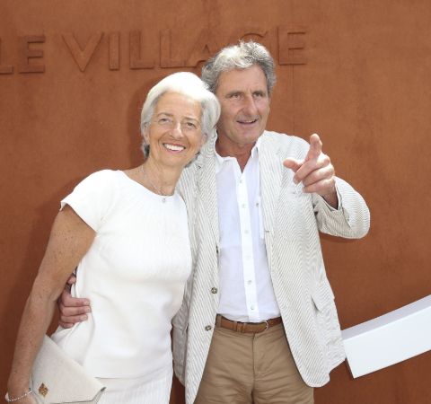 Xavier Giocanti in a white suit with wife Christine Lagarde.