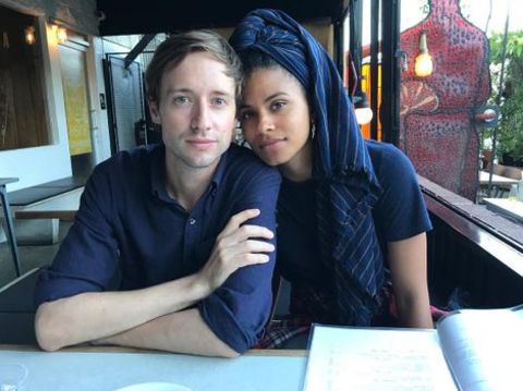 David Rysdahl giving a pose with his girlfriend, Zazie Beetz in a resturant.