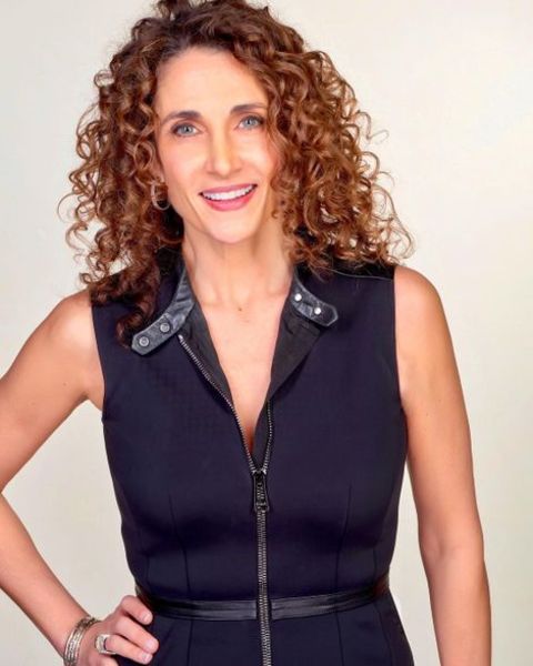 Melina Kanakaredes giving a pose during one of her photoshoots.