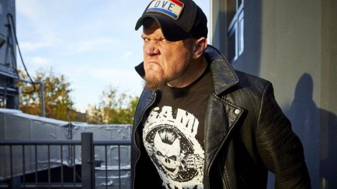 Sami Callihan in a black t-shirt and black cap.