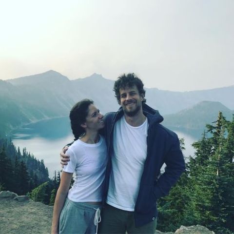 Reggie Gowland giving a pose along with his spouse, Emilie Eden at the Crater Lake National Park.