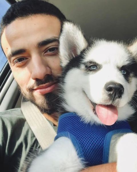 Freddy Miyares taking a selfie with his pet dog, Luna.