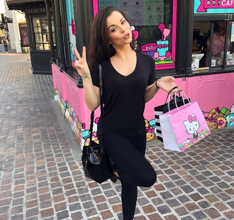 Chelsea Korka in a black outfit shopping.