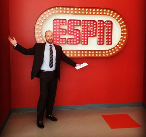 Ryen Russillo in a black suit at the sets of ESPN.
