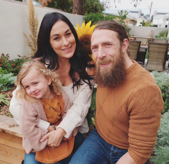 Brie Bella with his wife and their daughter