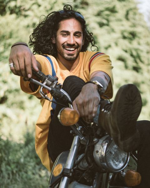 Andres Joseph poses a picture in his bike