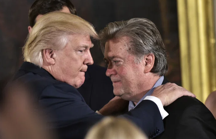 Trump (Left) congratulates White House strategist Stephen Bannon (Right) in Washington