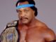 Ron Simmons poses a picture with his belt.