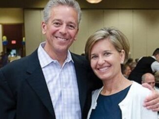 Polly Brennaman and Thom Brennaman pose for a picture.