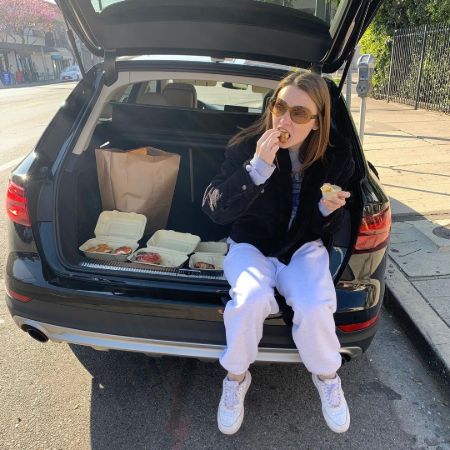 Jessica Barden enjoying Bagels in her car
