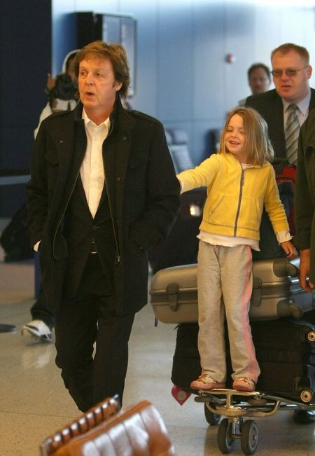 Beatrice McCartney with her father Paul McCartney at an airport
