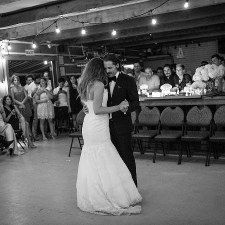 Linzey Rozon dancing on her wedding day with her husband.