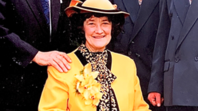 Irene Mary Taylor posing for a picture in a yellow clothing