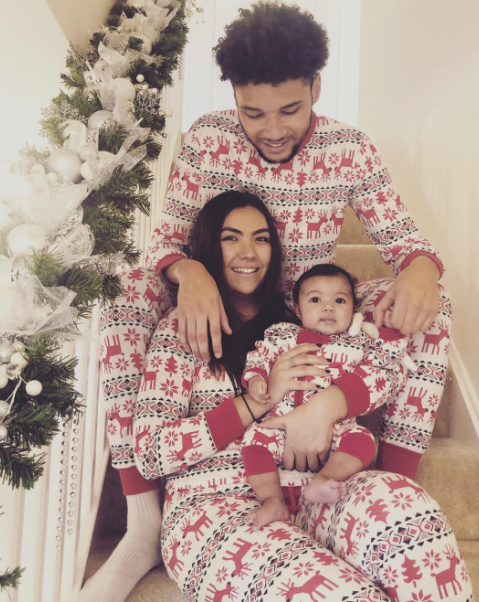 Lee Angol with his girlfriend and their first baby