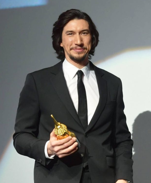 Adam Driver with his award