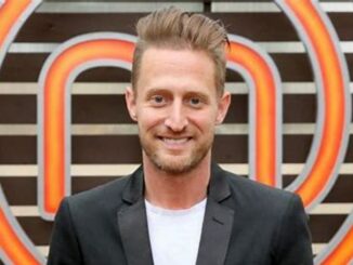 Michael Voltaggio dressed up and smiling for a photo.