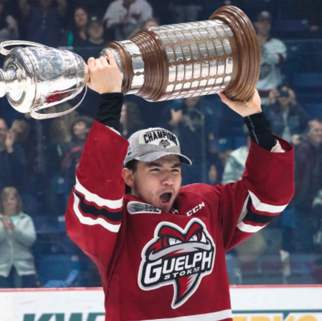 Nick Suzuki Holding Trophy