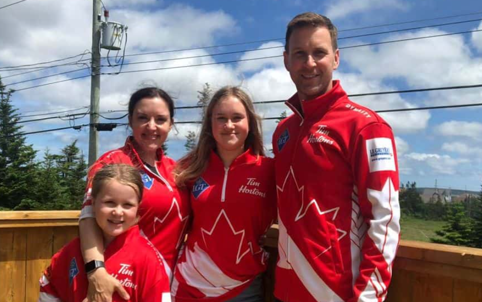 Brad Gushue with his wife and children