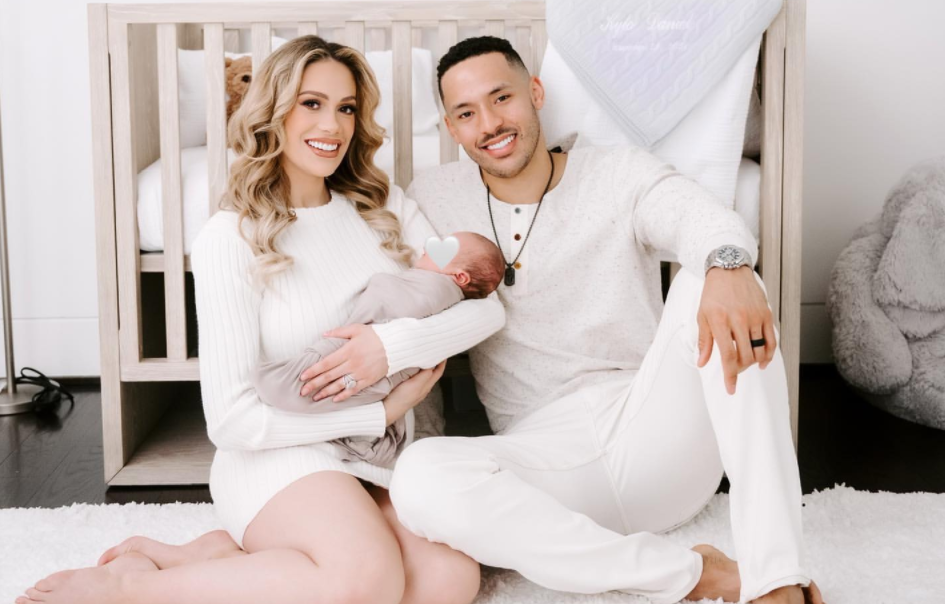 Carlos Correa with his wife and their son