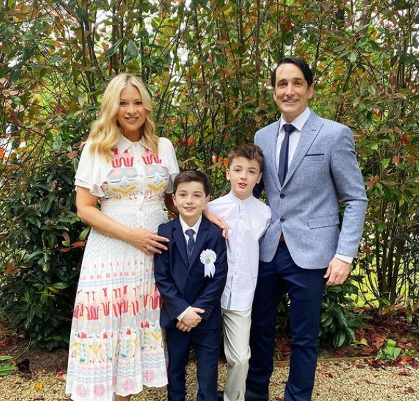 Laura Woods with her husband Mark Arigho, and her elder son attending the first communion of the youngest one