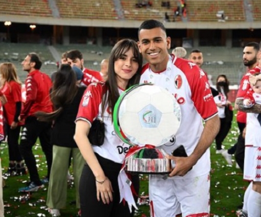 Walid Cheddira with his award pictured with a mysterious lady