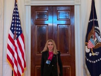 Anca Faur standing straight wearing a suit.